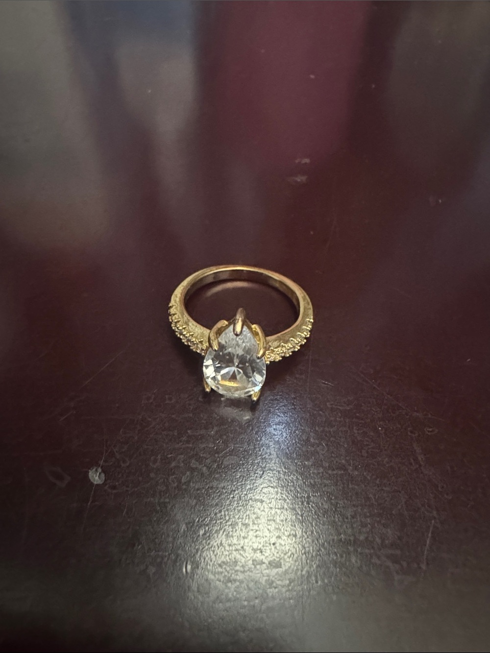 Gold Pear-Cut Solitaire Ring with Clear Stone